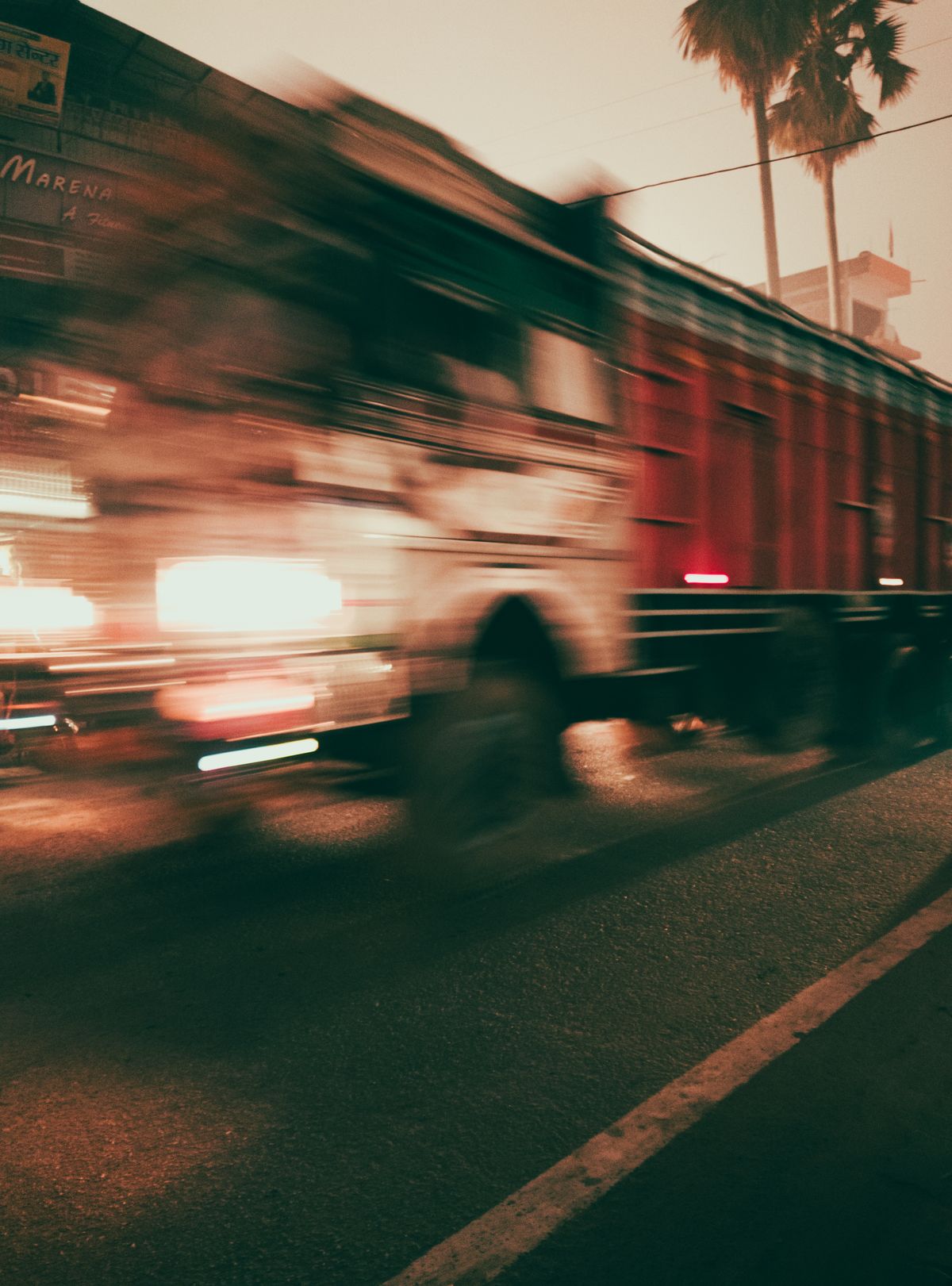 Truck in motion blur speeding through the twilight